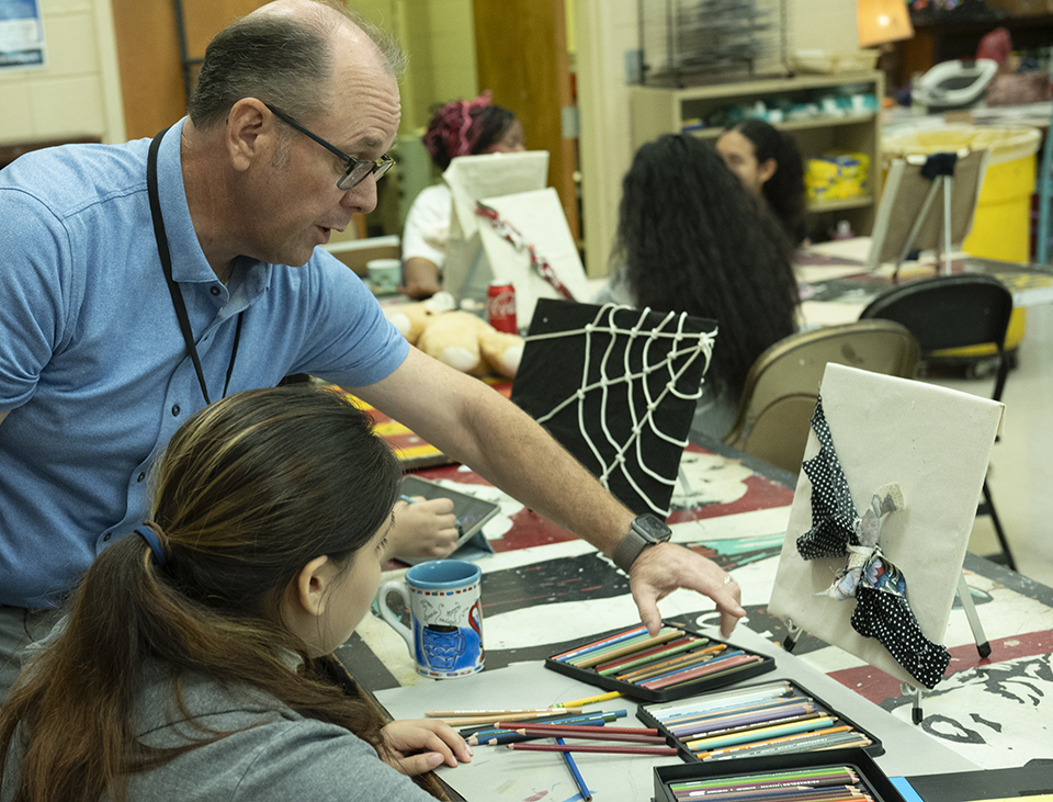 Dr. Stan Dodson teaching his students in his art classroom.