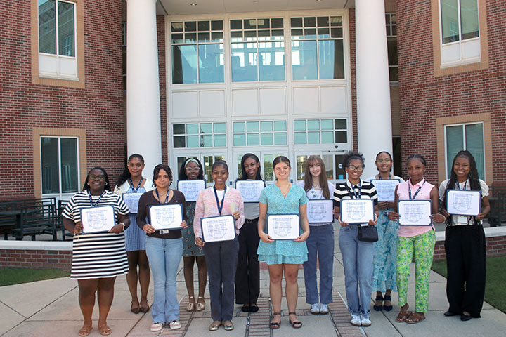 Group of girls holding certificates