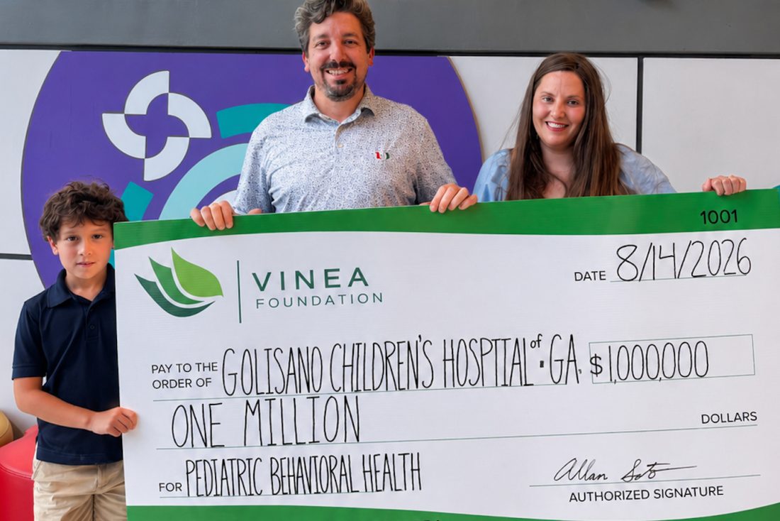Soto Family holding symbolic check for $1 million