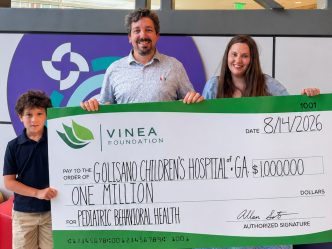 Soto Family holding symbolic check for $1 million