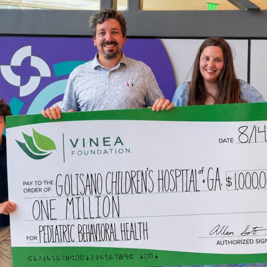 Soto Family holding symbolic check for $1 million