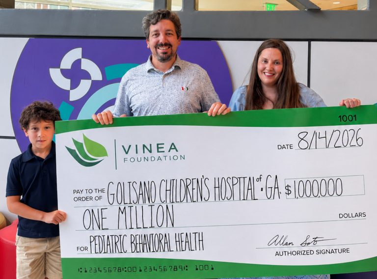 Soto Family holding symbolic check for $1 million