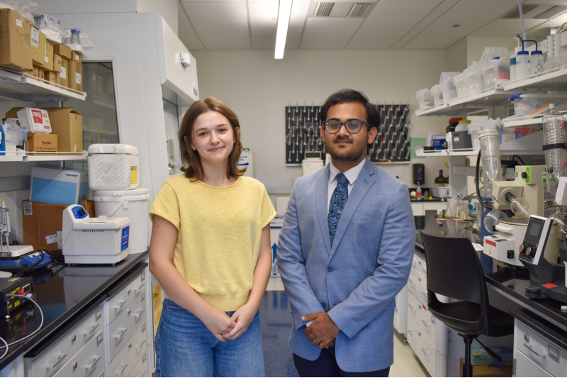 woman and man standing in laboratory